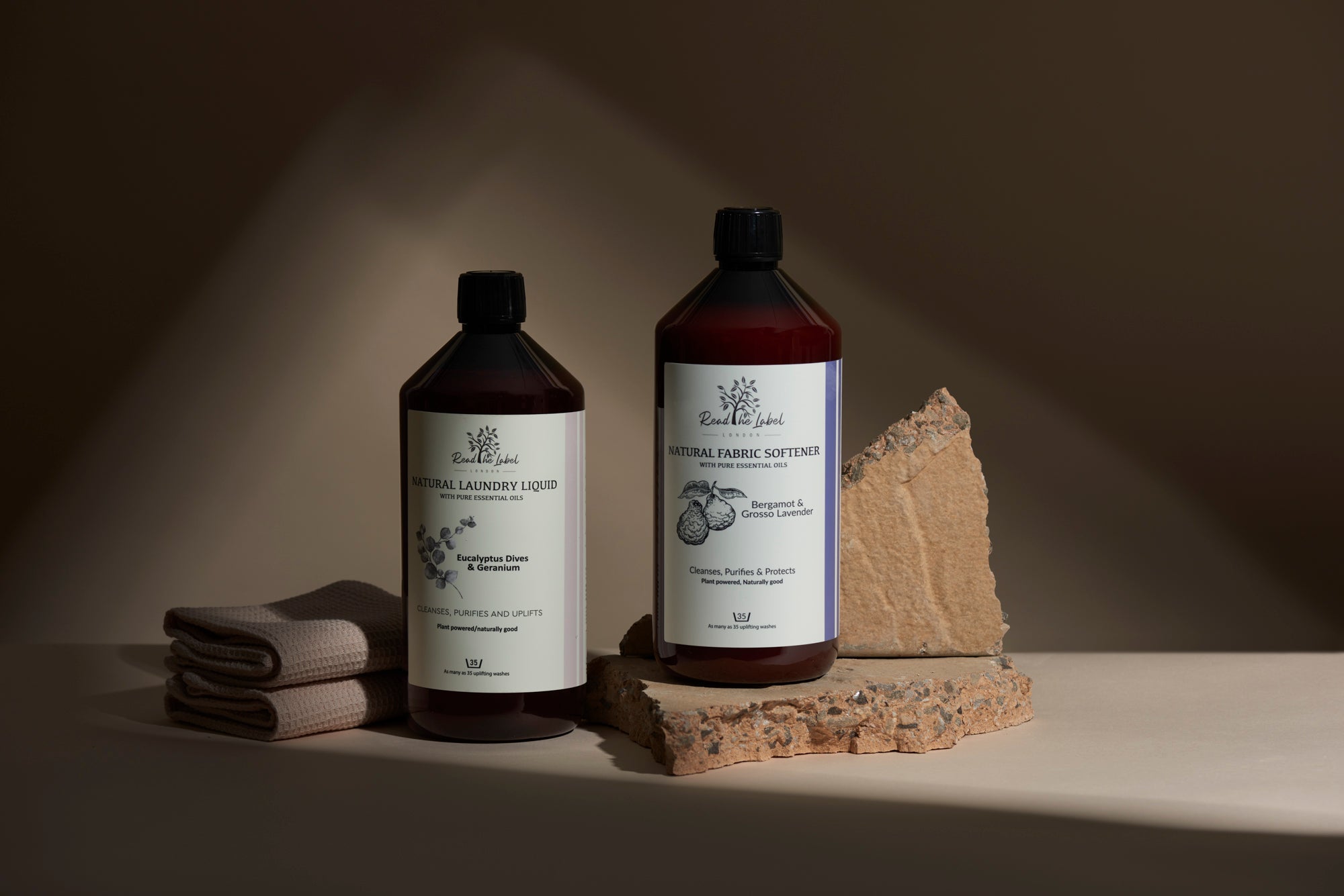 Natural laundry duo bundle featuring detergent and fabric softener bottles with essential oil scents — view 2