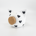 Queen of Hearts ceramic piggy bank in white with hand-painted black heart motifs and cork snout