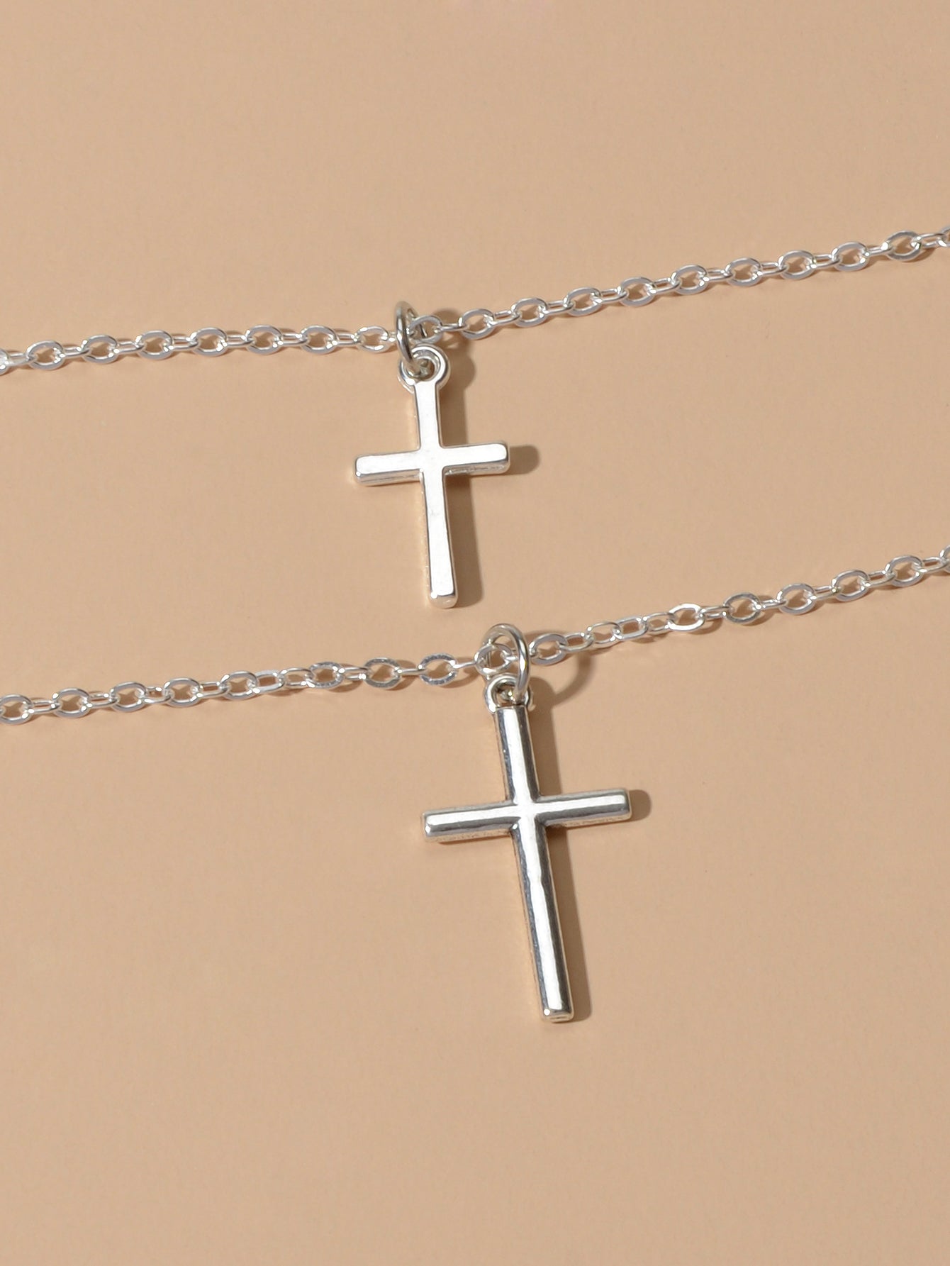 Silver double layer cross necklace featuring delicate chains and a minimalist pendant for women — view 5