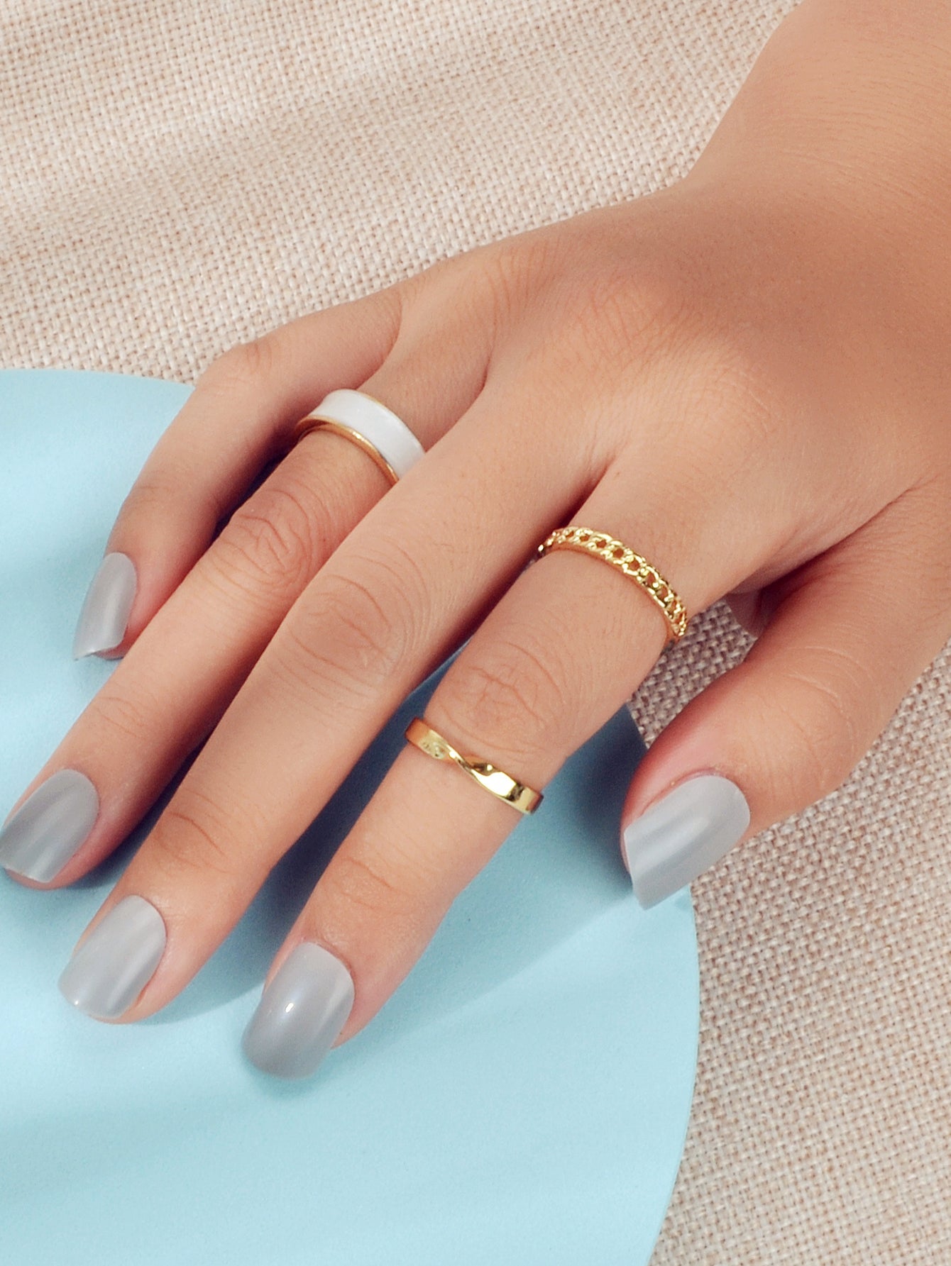 Three piece retro stackable white enamel midi knuckle ring set displayed together