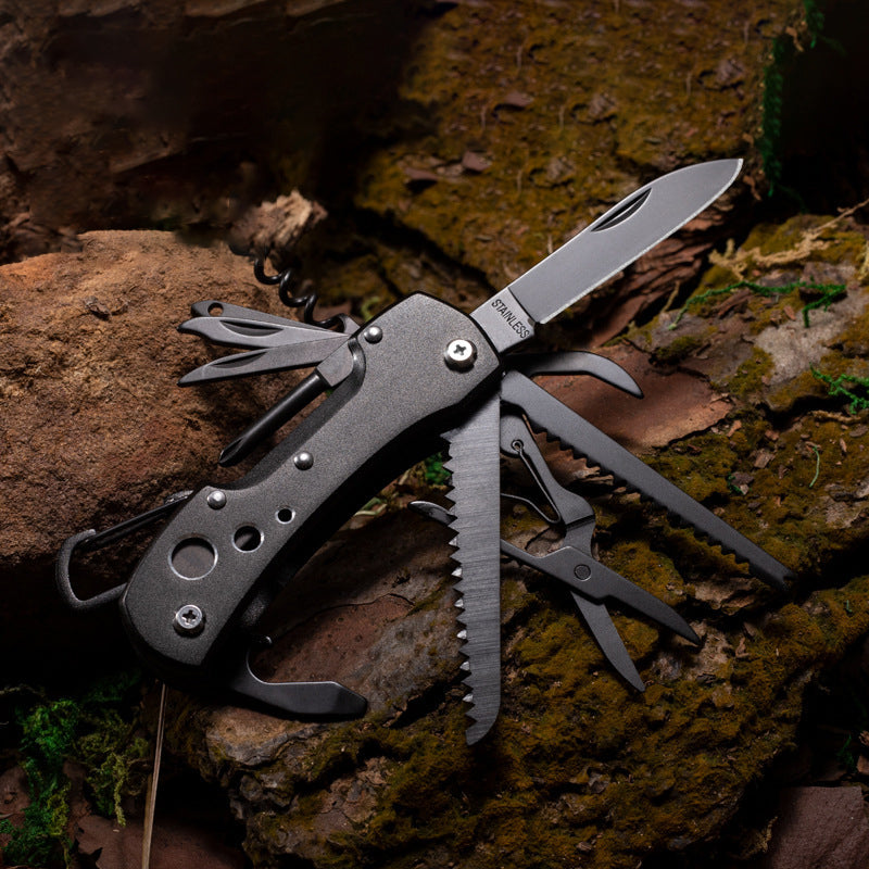 Mysterious black folding multi-tool pocket knife with stainless steel blades and outdoor survival tools.