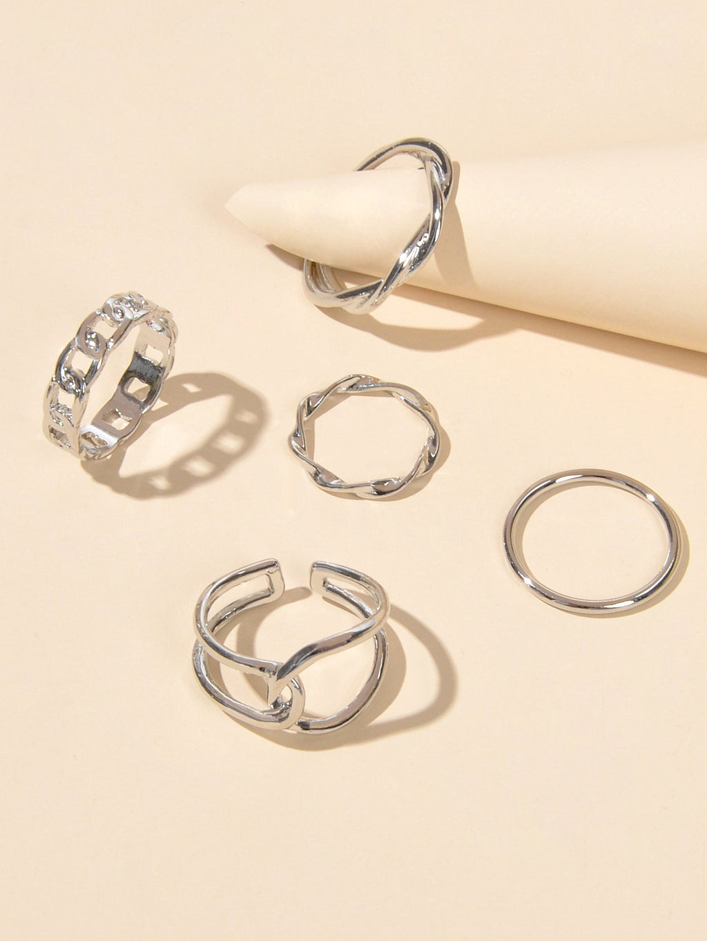 Set of five minimalist stackable midi finger rings in trendy gold and silver finishes