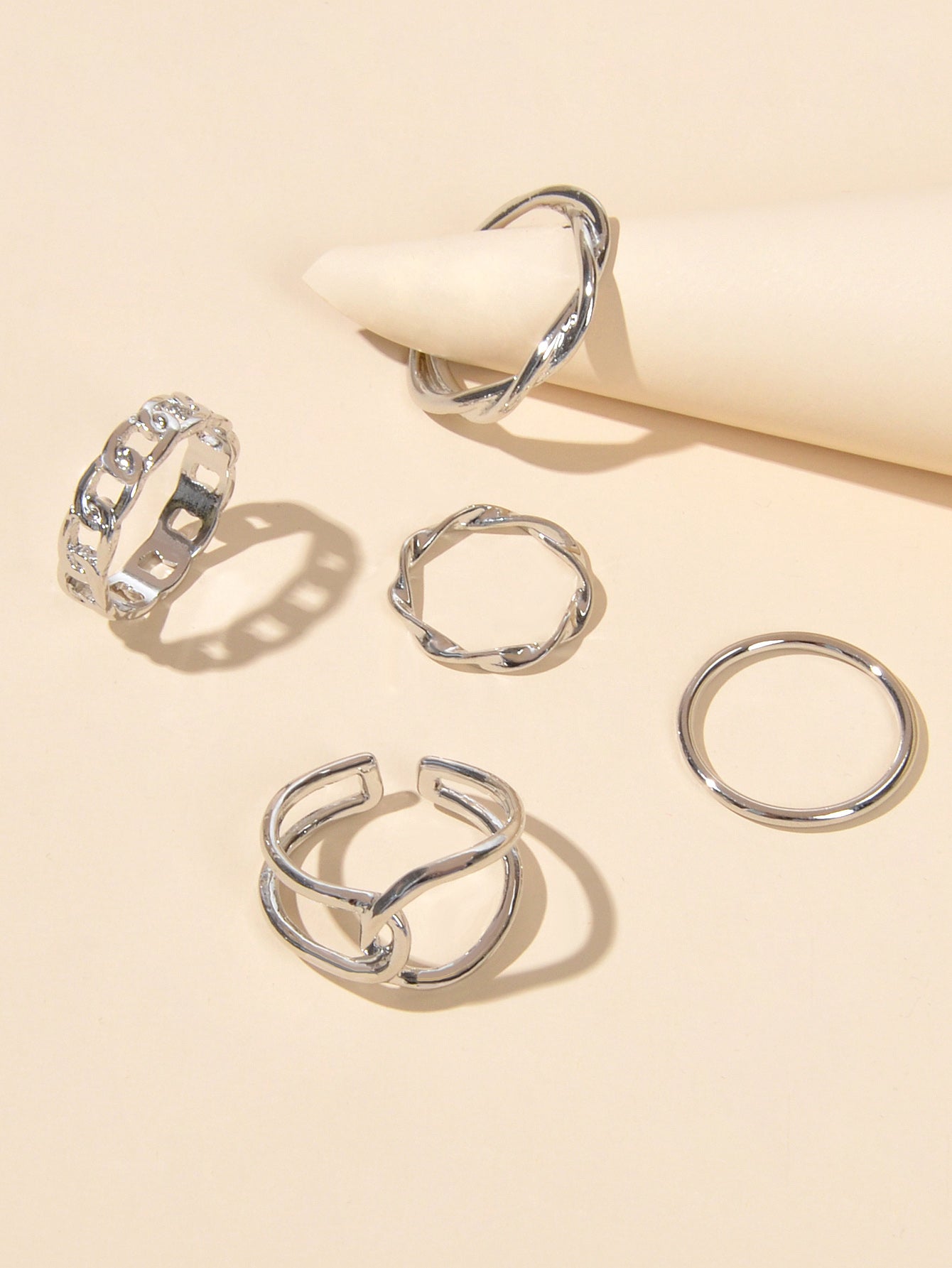 Set of five minimalist stackable midi finger rings in trendy gold and silver finishes