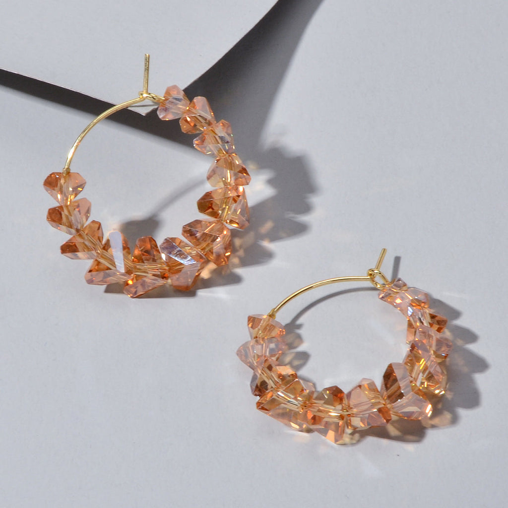 Transparent acrylic bead hoop dangle earrings for women on a clean background. — view 5