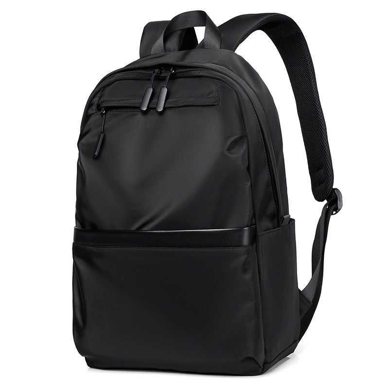 Minimalist black waterproof nylon laptop backpack with zippered pockets for urban commuting and travel — view 2