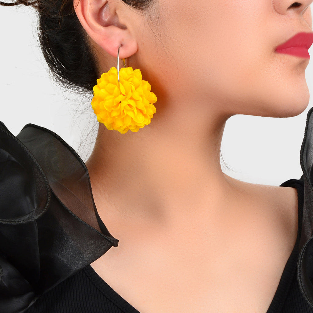 Yellow and hot pink chiffon blossom floral dangle hoop earrings on a clean background