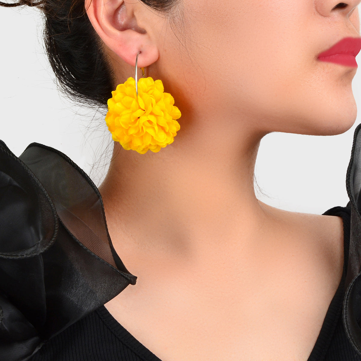 Yellow and hot pink chiffon blossom floral dangle hoop earrings on a clean background