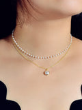Retro gold double layer chain necklace featuring a classic lustrous pearl pendant for women