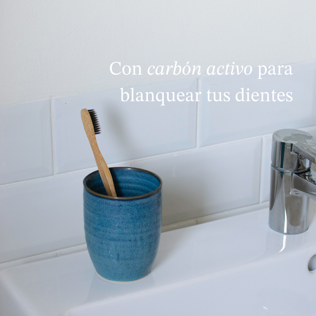 Eco-friendly bamboo toothbrush with soft whitening bristles and a natural wooden handle — view 2