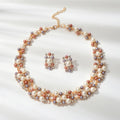 Luxurious rhinestone and pearl collar necklace with matching stud earrings set for formal engagement events.