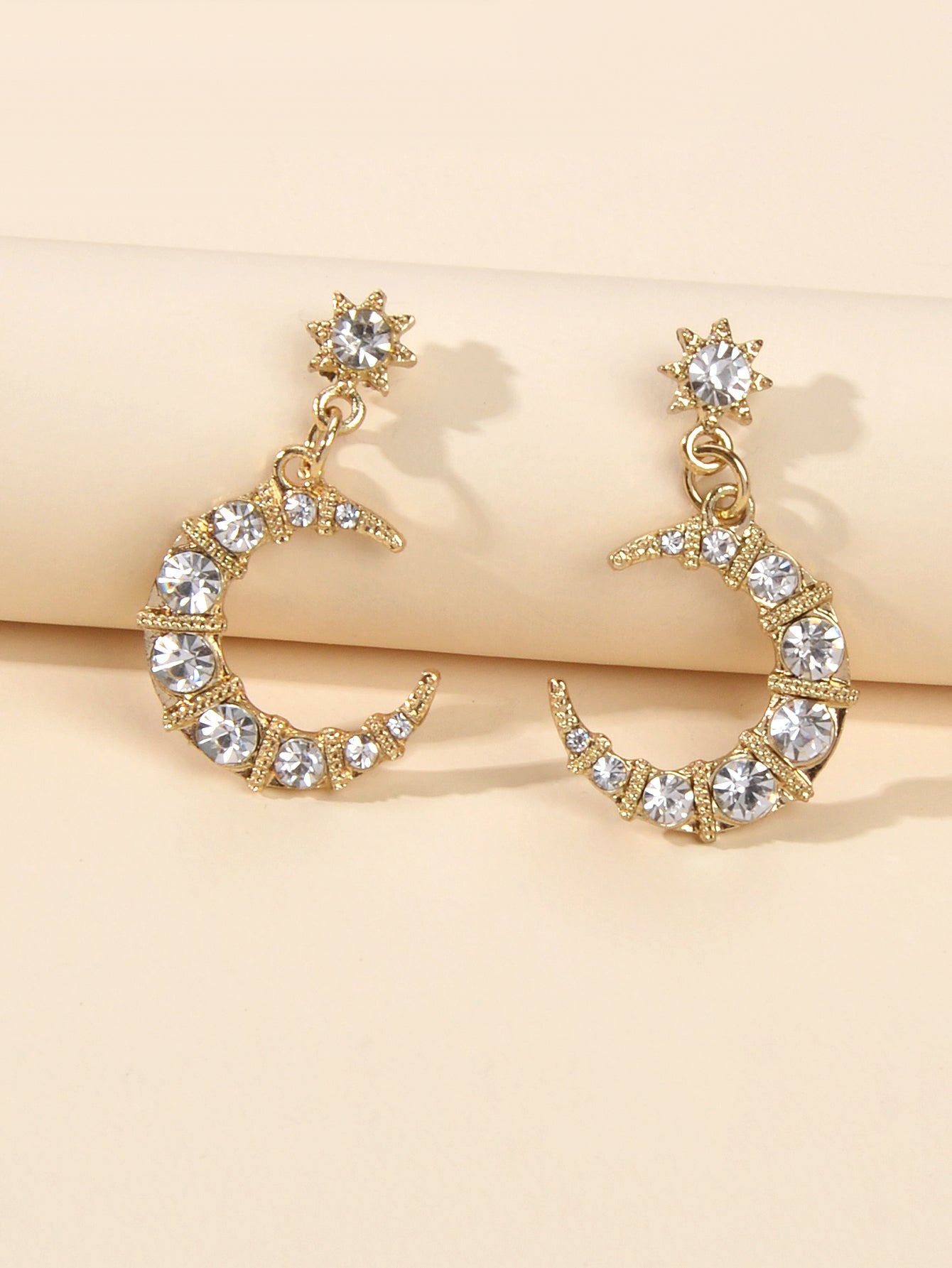 Textured luxury rhinestone star and moon dangle earrings for weddings and evening wear