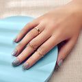 Minimalist gold stackable ring set featuring three polished metal bands arranged gracefully together