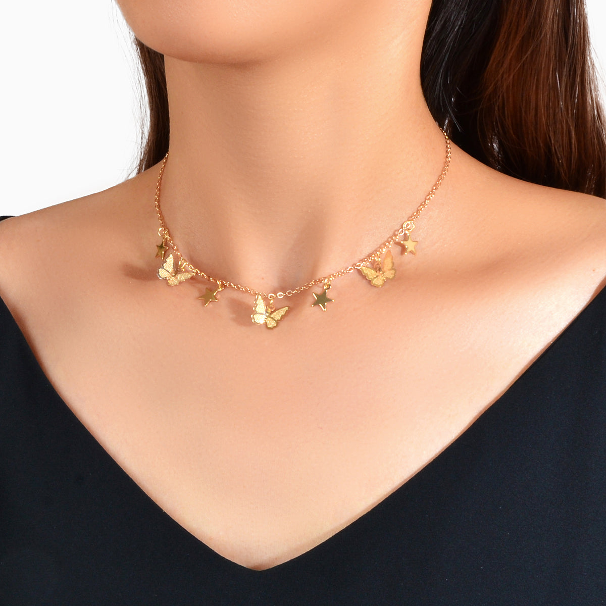 Gold chain collar necklace with delicate star and butterfly charms for women's party wear