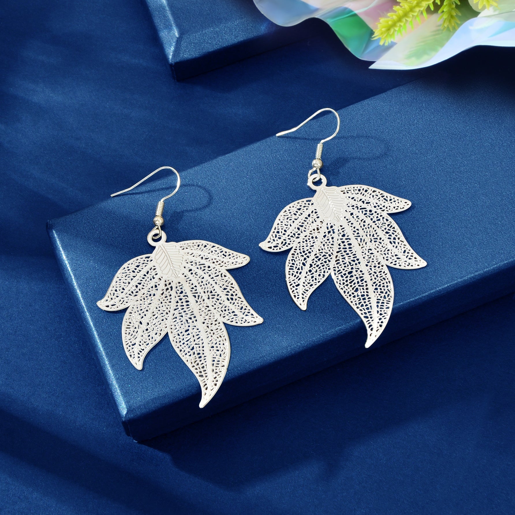 Silvery hollow leaf dangle earrings, lightweight metallic bohemian jewelry with a silver tone finish — view 3