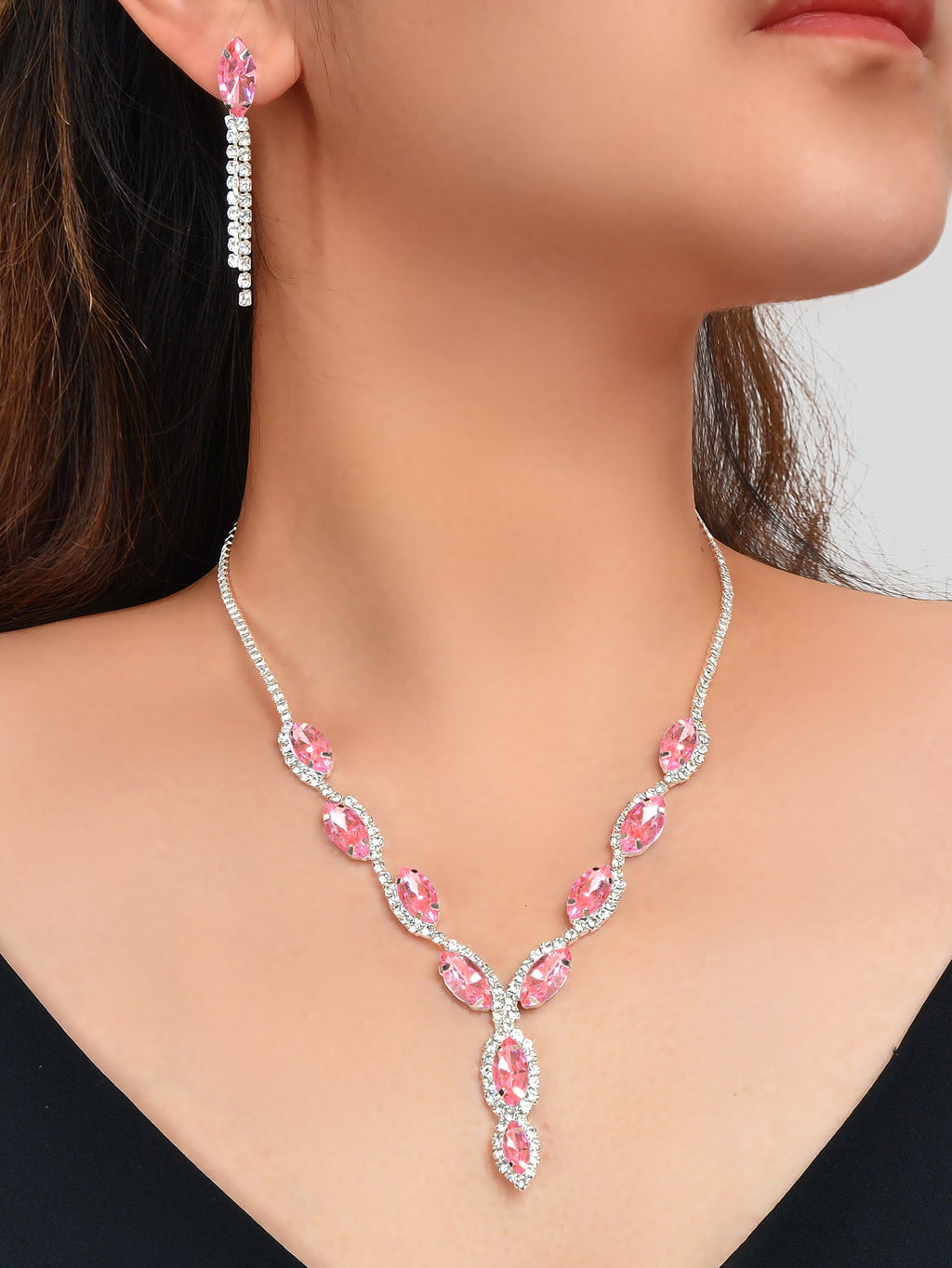 Luxurious pink crystal wedding jewelry set featuring a water drop necklace and matching dangle earrings