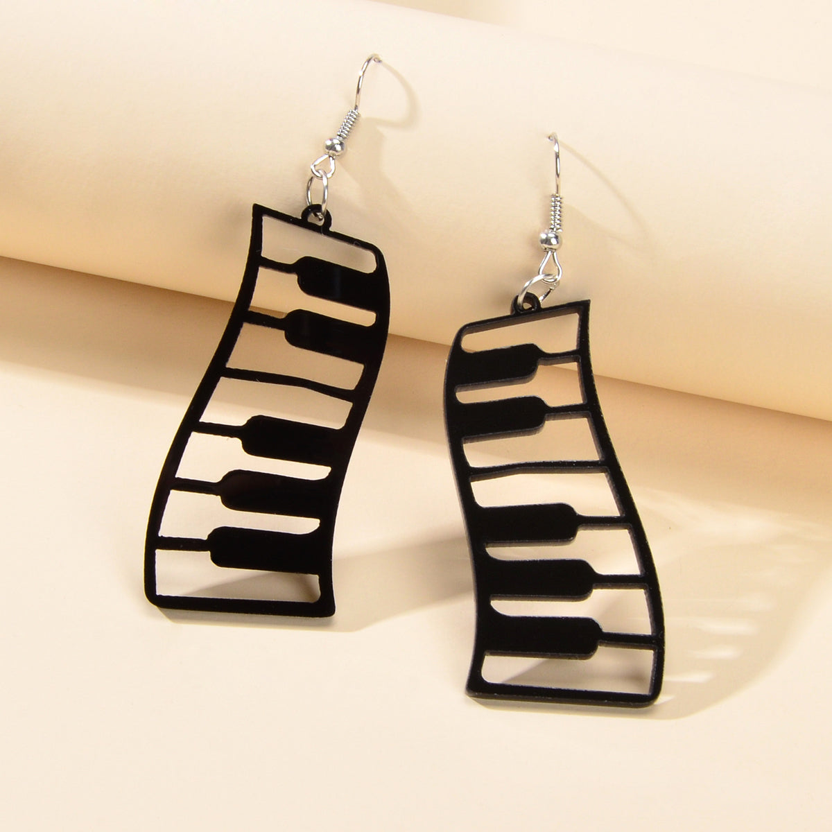 Black and white resin piano keyboard drop statement earrings with dangle design