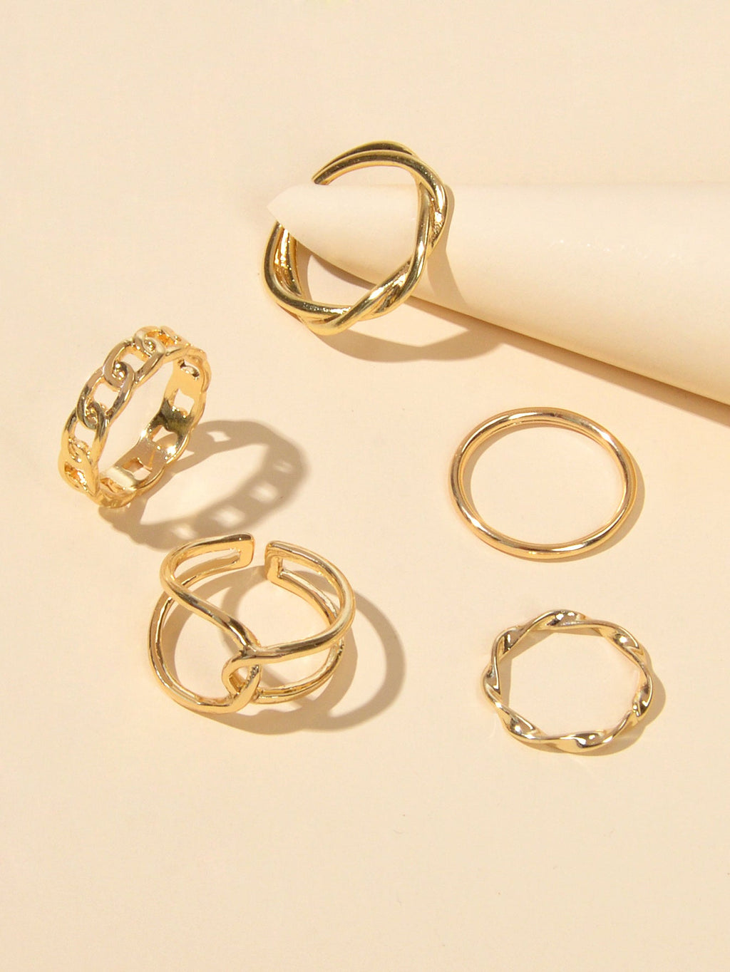 Set of five minimalist stackable midi finger rings in trendy gold and silver finishes — view 4