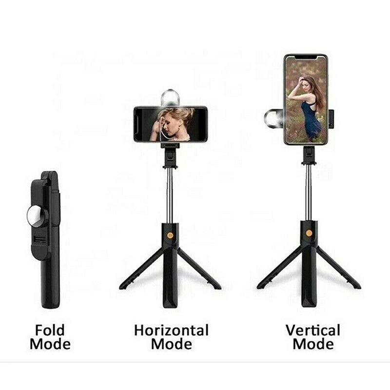 Wireless Bluetooth selfie stick tripod fully extended with smartphone mount and remote control attached — view 4
