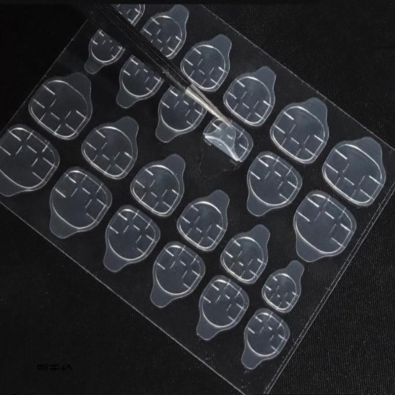 Clear double-sided adhesive press on nail stickers on a transparent plastic backing sheet. — view 4