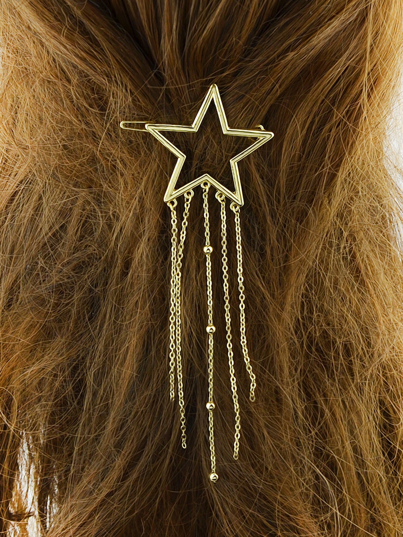 Gold star tassel hair barrette with long cascading chains for wedding and party hairstyles