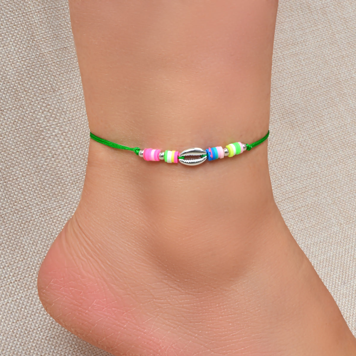 Handmade boho chic adjustable anklet featuring colorful soft beads and delicate natural shell accents for summer