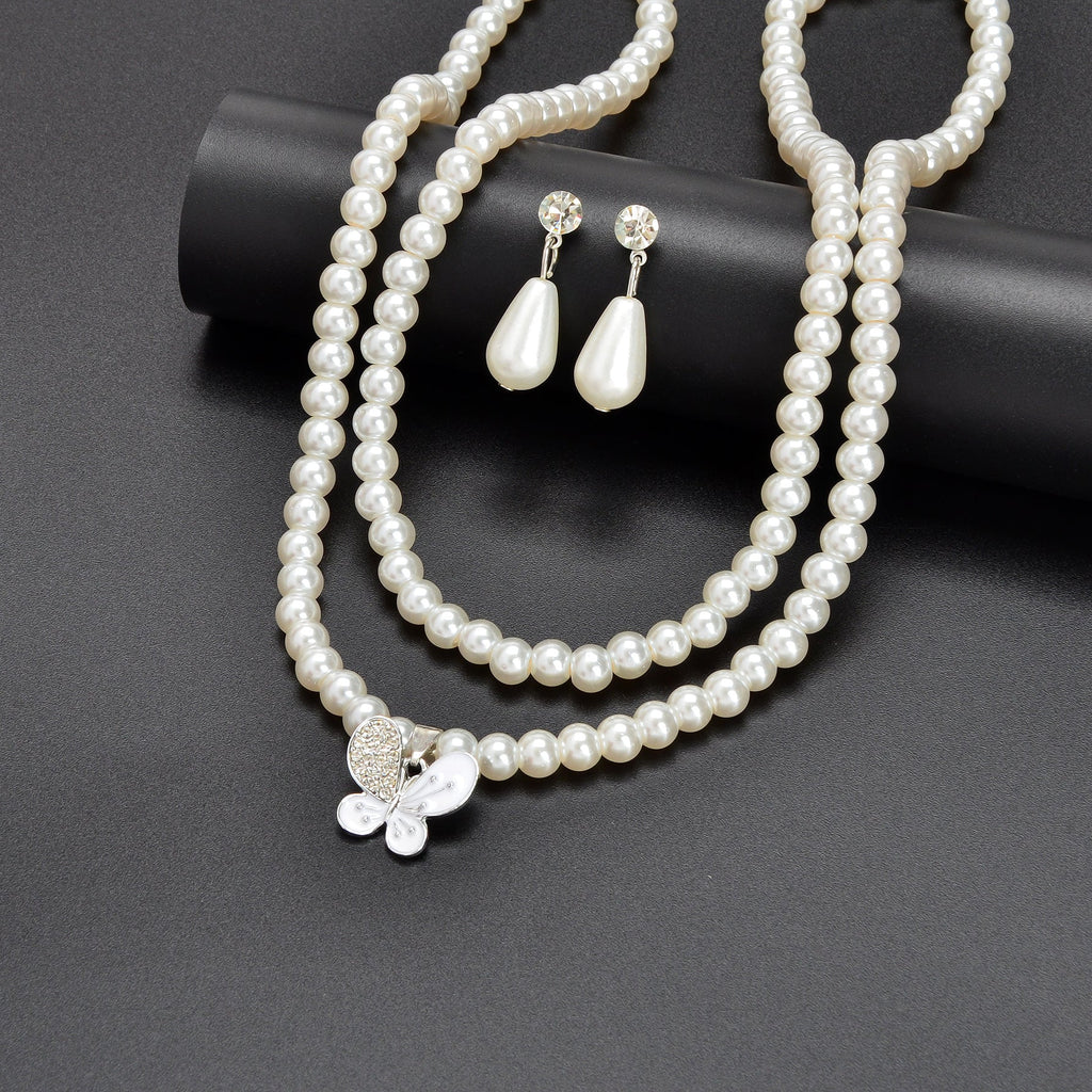 Imitation pearl jewelry set featuring a double layered necklace and matching water drop earrings — view 5