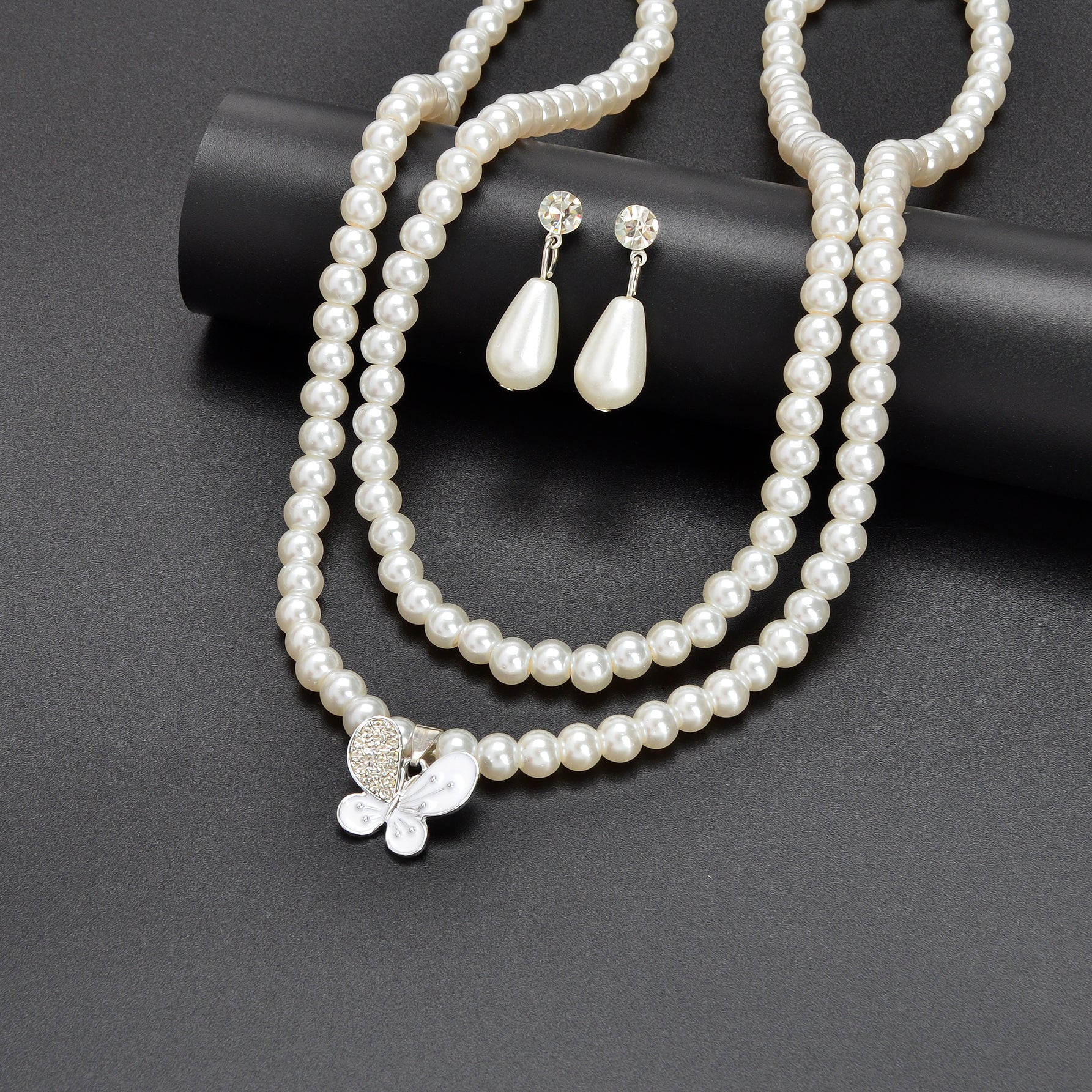 Imitation pearl jewelry set featuring a double layered necklace and matching water drop earrings — view 5