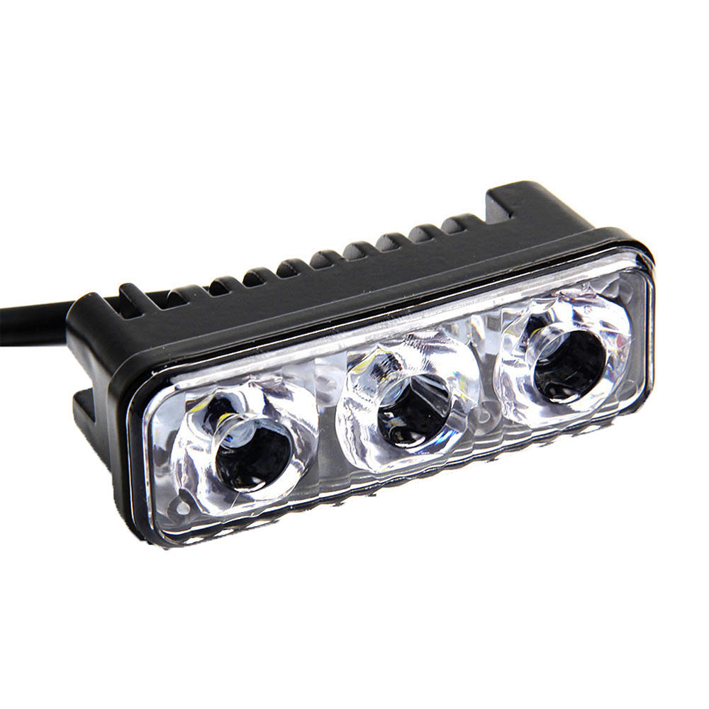 Black aluminum 3-LED daytime running lights with cool white beams and adjustable mounting brackets — view 2
