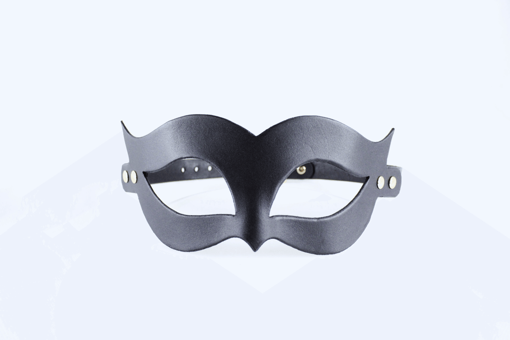 Handmade black leather fetish mask with gold-tone rivets and adjustable buckle strap for a secure fit.