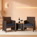 Brown 3-piece wicker outdoor patio bistro set with navy cushions and a square side table.