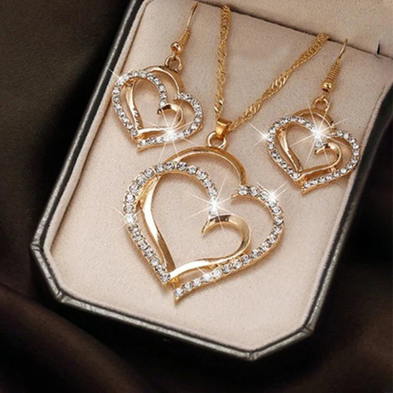 Heart shaped rhinestone necklace and matching earrings set in a silver zinc alloy finish — view 2