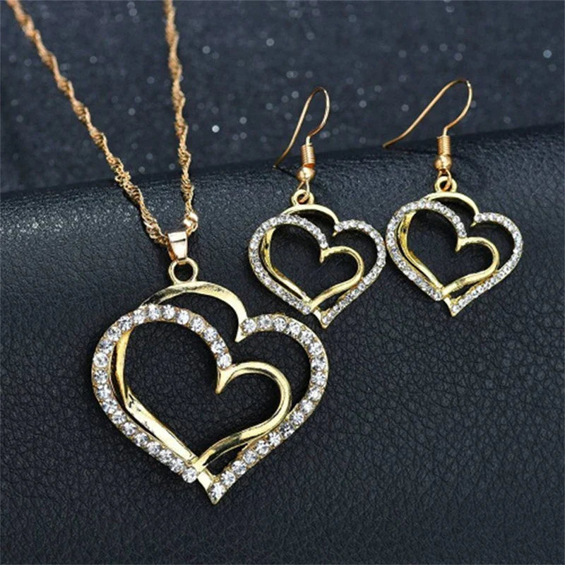 Heart shaped rhinestone necklace and matching earrings set in a silver zinc alloy finish — view 3