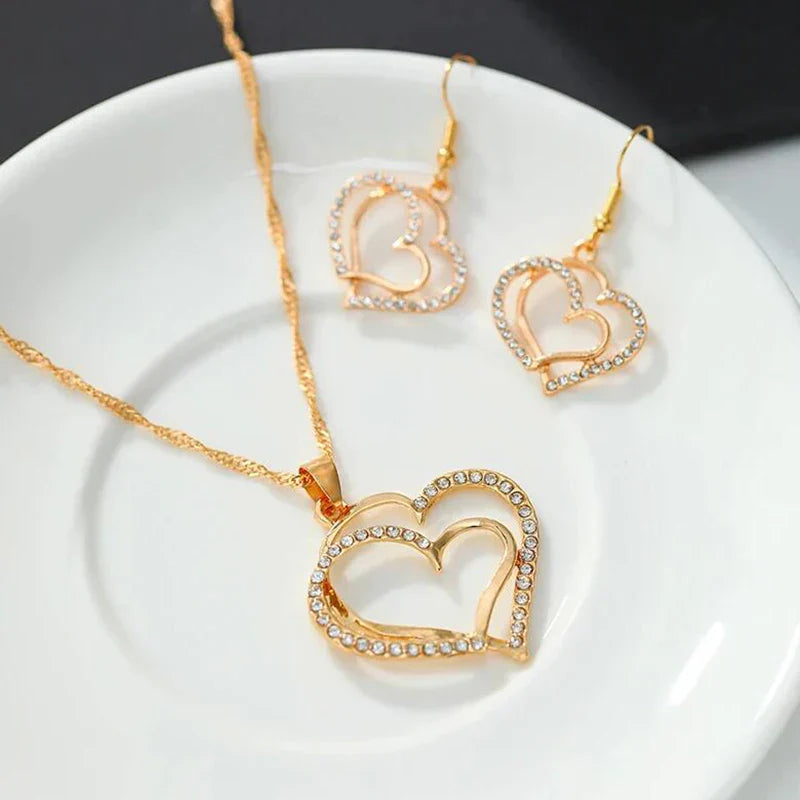 Heart shaped rhinestone necklace and matching earrings set in a silver zinc alloy finish — view 5