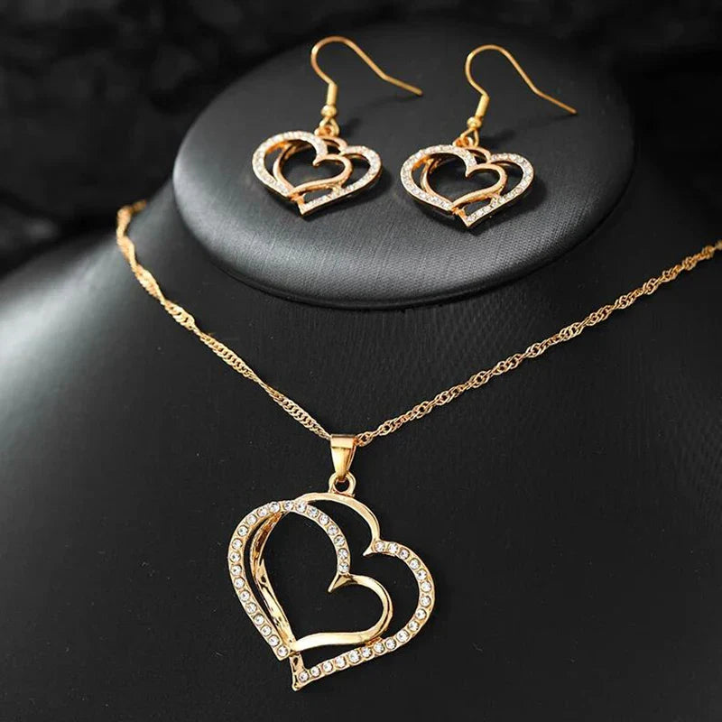 Heart shaped rhinestone necklace and matching earrings set in a silver zinc alloy finish — view 4