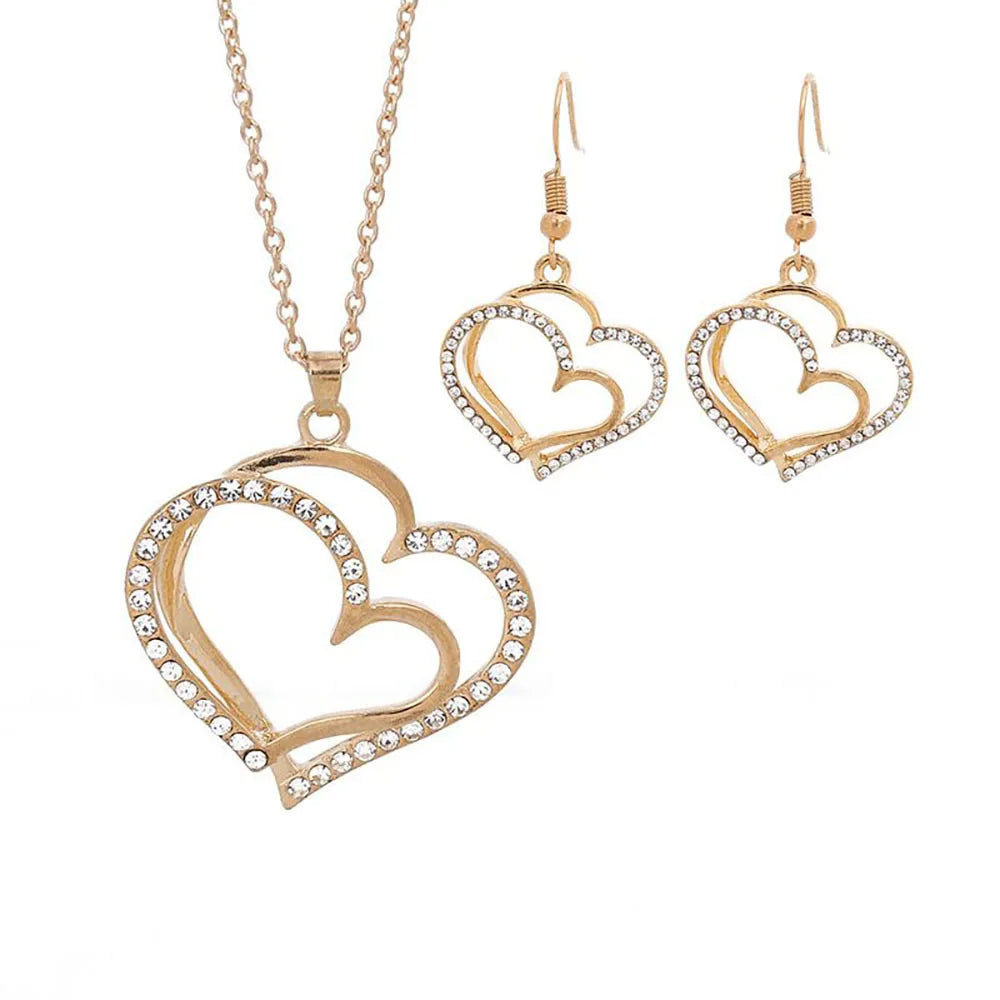 Heart shaped rhinestone necklace and matching earrings set in a silver zinc alloy finish