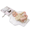 Foldable baby changing pad in durable waterproof polyester with mesh storage pockets and soft headrest.