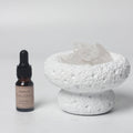White moon elegant home fragrance diffuser with floral ocean oil set in minimalist setting