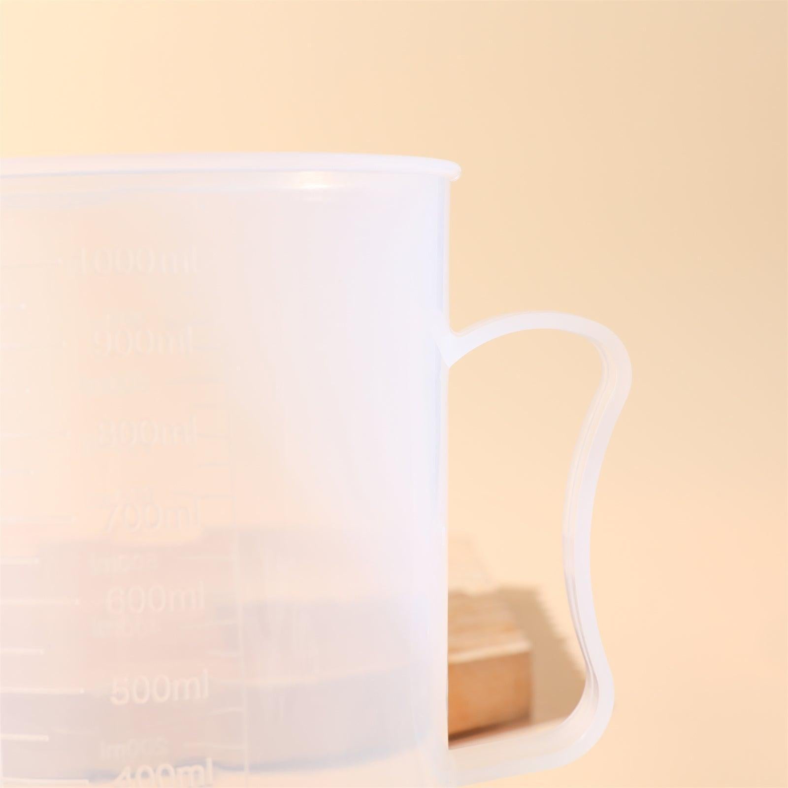Clear 1000ml measuring cup with precise graduation marks and convenient pour spout for kitchen use — view 3