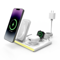 Black 4-in-1 foldable wireless charging station with LED night light powering multiple smart devices
