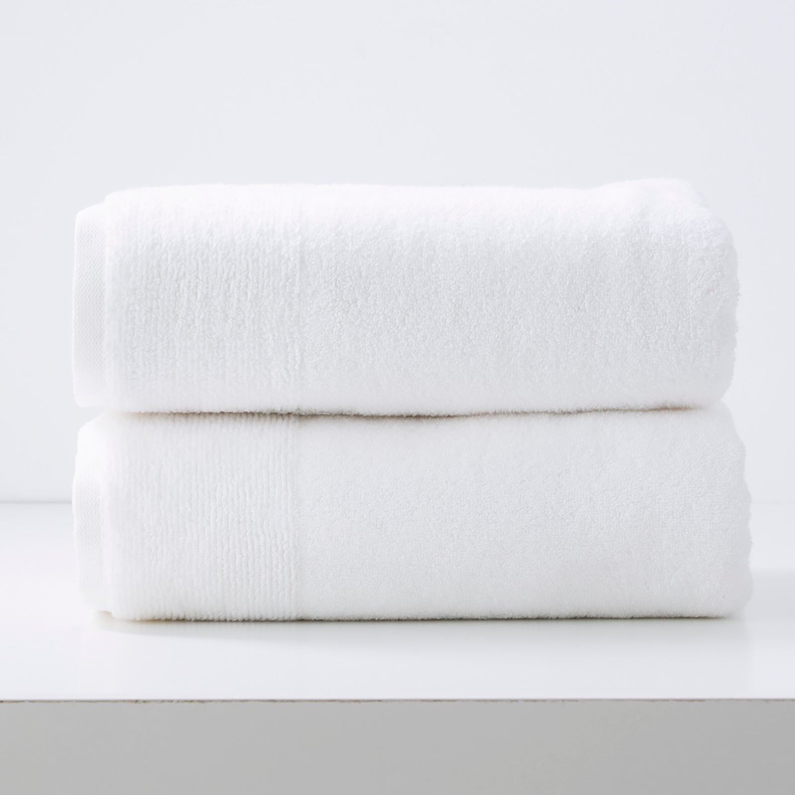 Crisp snow white Aireys quick dry bath towel set showing plush zero twist cotton material — view 2