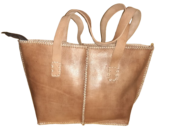 Medium rectangular rustic cowhide leather handbag with white stitching and sturdy dual handles.