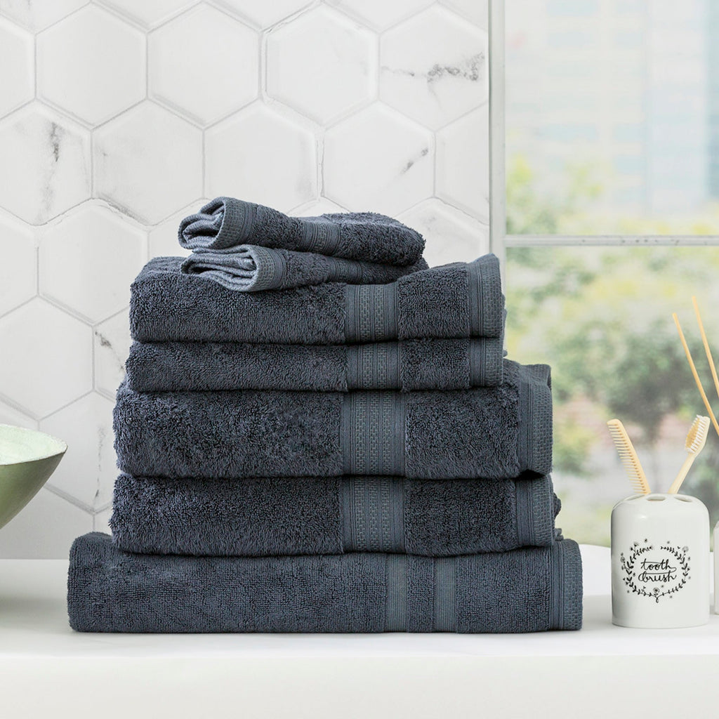 Stella Indigo bamboo cotton blend bath towel set neatly folded in a luxurious bathroom setting