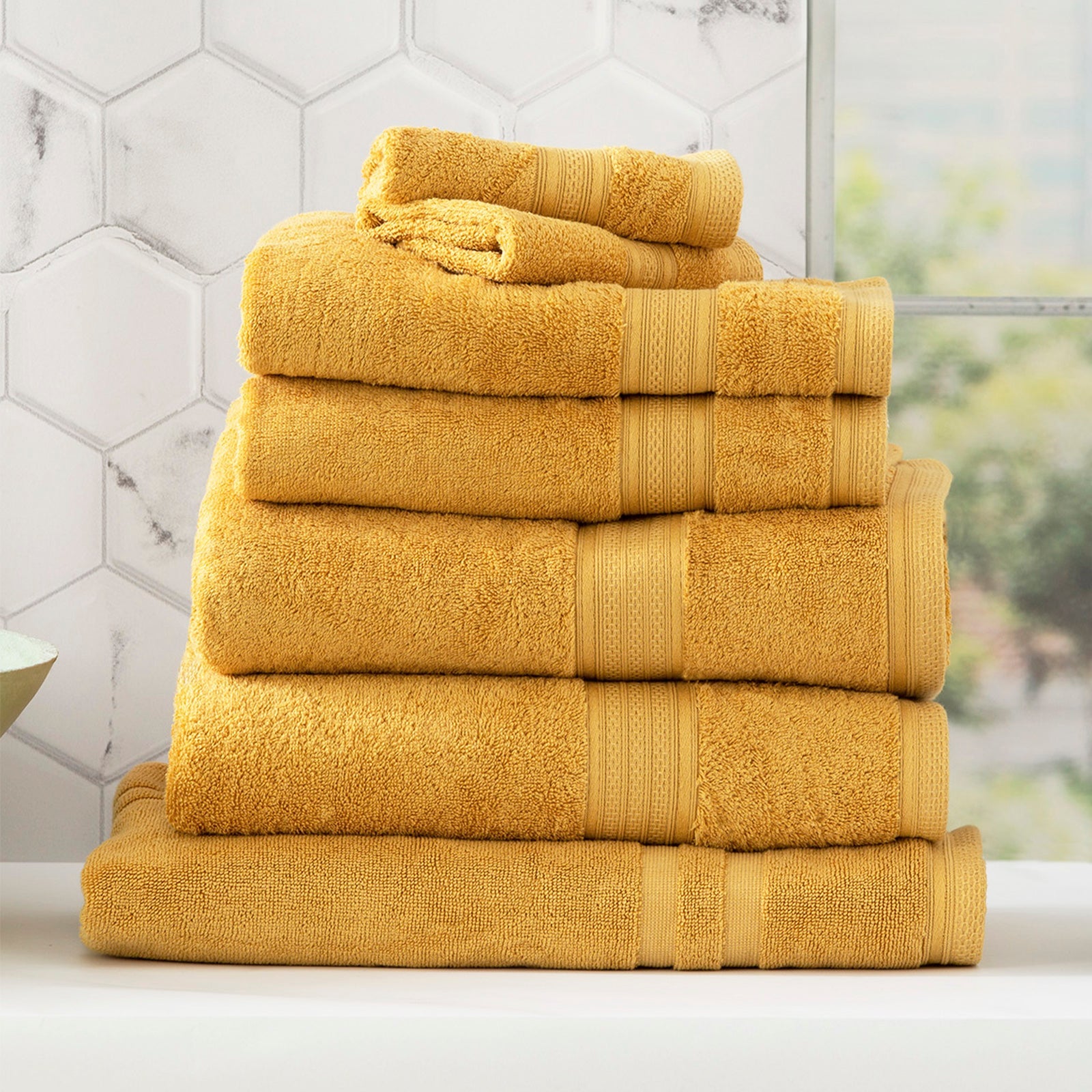 Stella mustard bamboo towel set folded, featuring plush yellow bamboo cotton fabric and woven details.