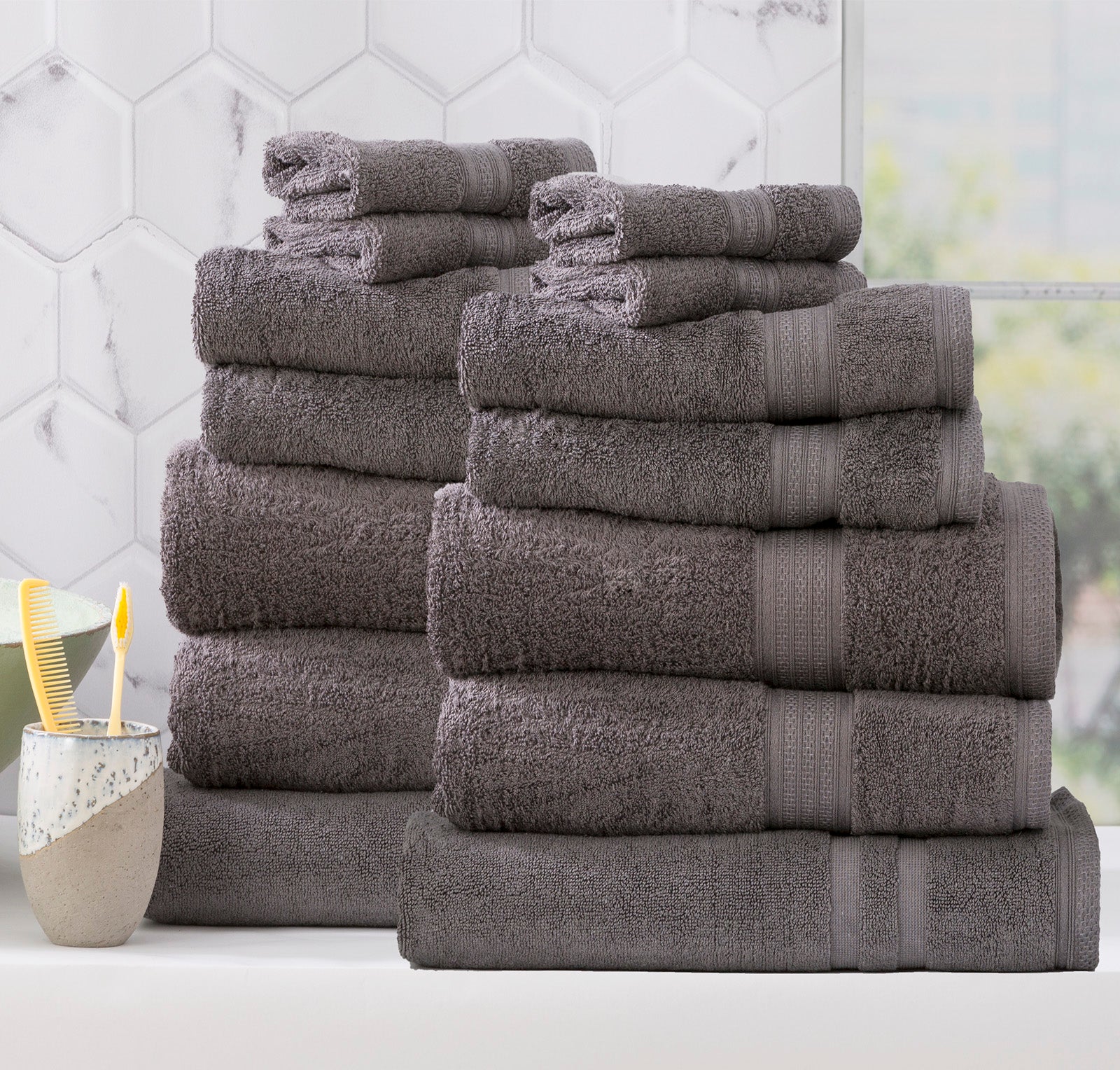 Charcoal grey bamboo cotton bath towel set neatly folded in a luxurious bathroom setting — view 2