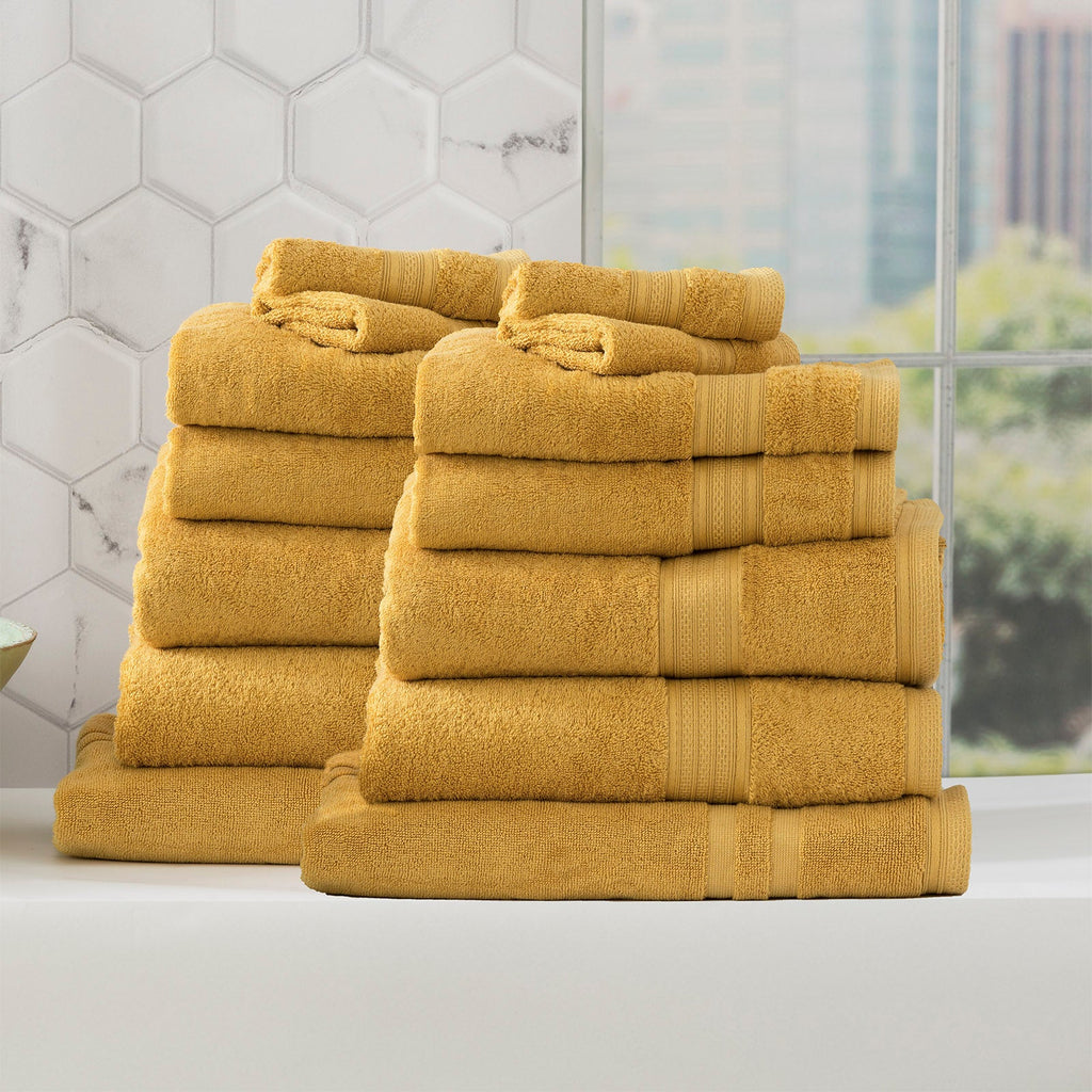 Stella mustard bamboo towel set folded, featuring plush yellow bamboo cotton fabric and woven details. — view 2