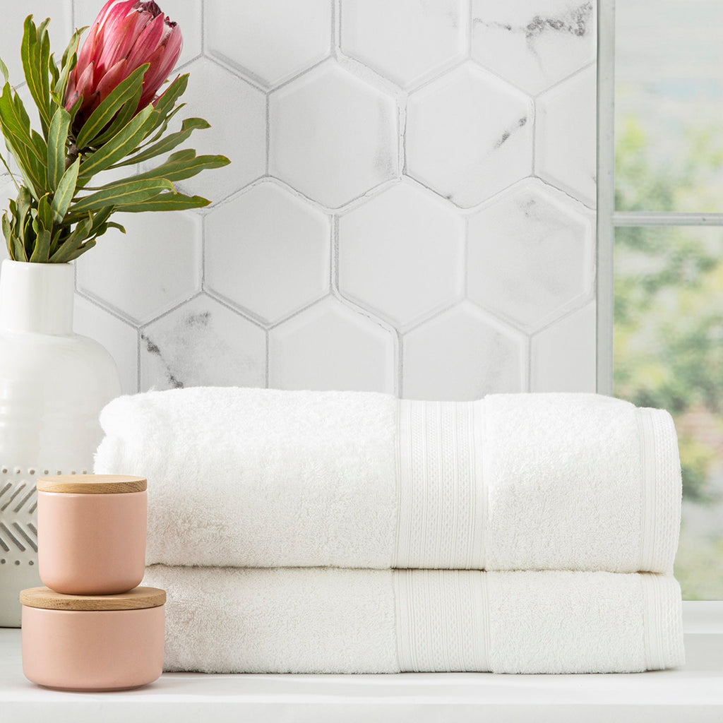 Stack of white Stella bamboo cotton blend luxury bath towels with integrated hanger loops — view 3