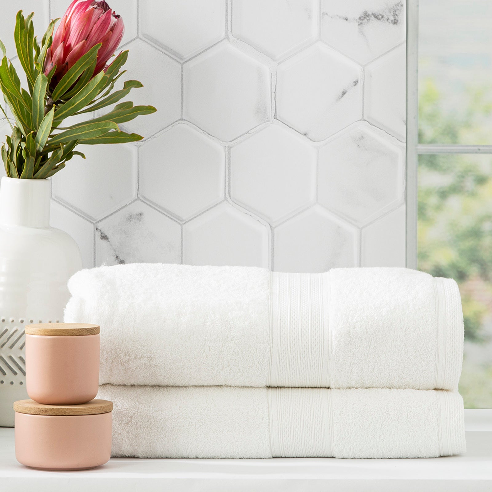 Stack of white Stella bamboo cotton blend luxury bath towels with integrated hanger loops — view 3