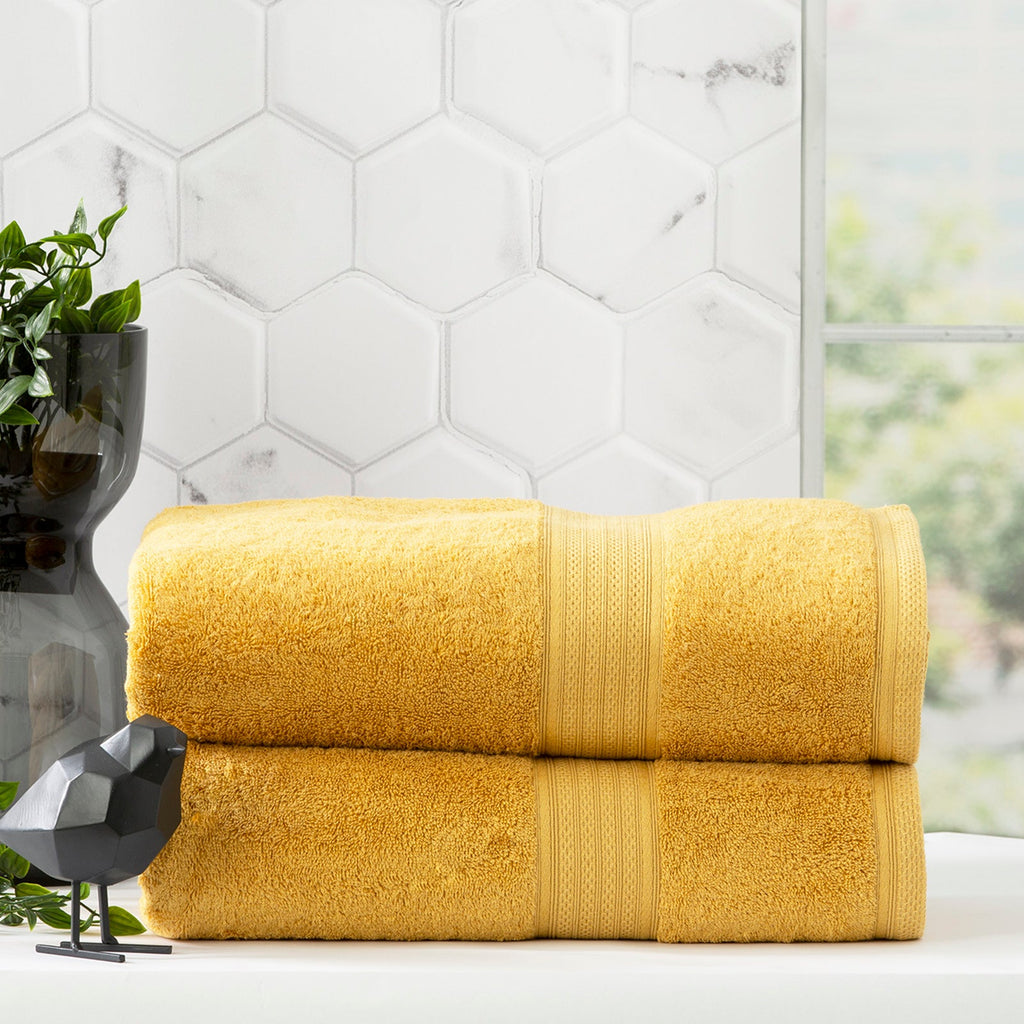Stella mustard bamboo towel set folded, featuring plush yellow bamboo cotton fabric and woven details. — view 3
