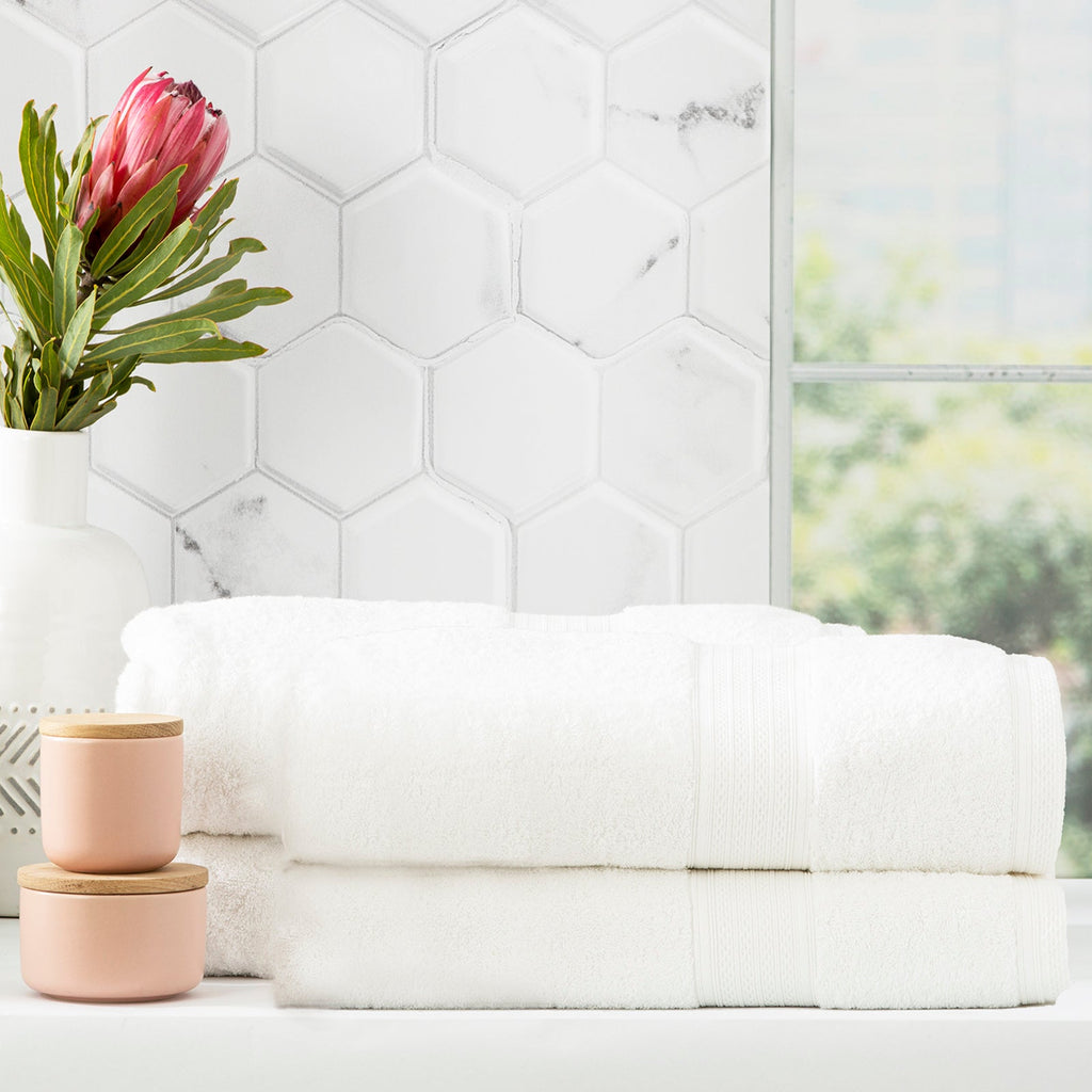 Stack of white Stella bamboo cotton blend luxury bath towels with integrated hanger loops — view 4
