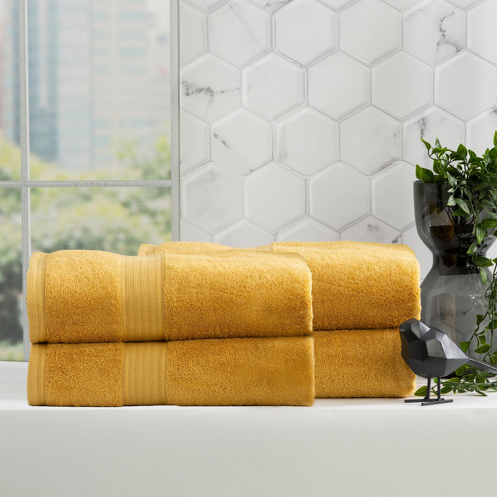 Stella mustard bamboo towel set folded, featuring plush yellow bamboo cotton fabric and woven details. — view 4